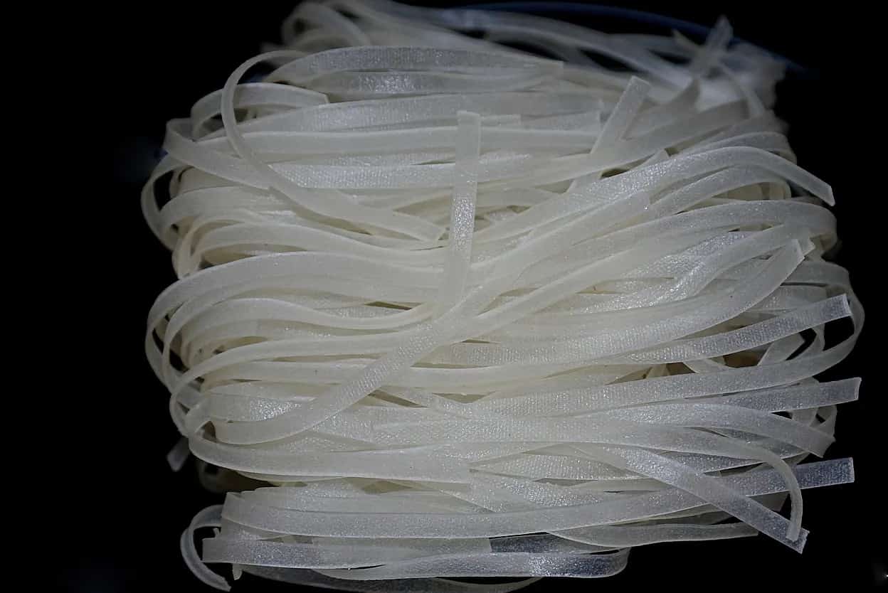 Wide Vietnamese bánh phở rice noodles before cooking